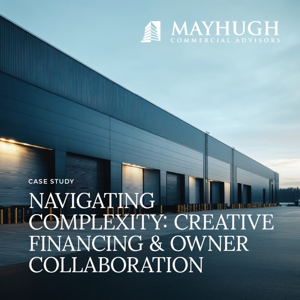 Exterior view of a modern industrial warehouse at dusk with text overlay about a case study on creative financing and owner collaboration by Mayhugh Commercial Advisors.
