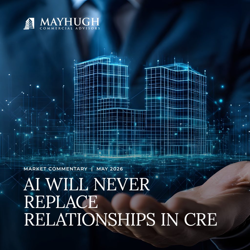 A digital rendering of buildings hovers above a person's open hand, with the text "AI will never replace relationships in CRE" and the Mayhugh Commercial Advisors logo.